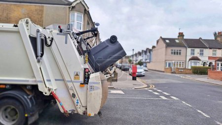 Photo for Garbage truck with bin on the street ,environmental cleaning . High quality photo - Royalty Free Image