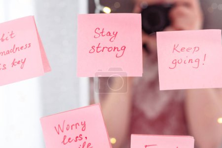 inspirational quotes on pink sticker on the mirror,handwriting text.