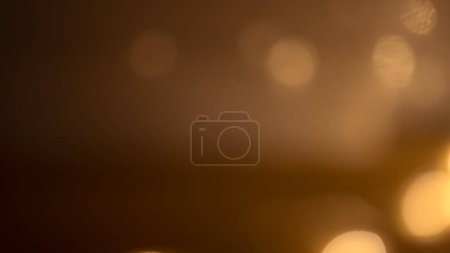 Rich brown-golden bokeh background, evoking warmth and elegance, perfect for adding depth and sophistication to designs.