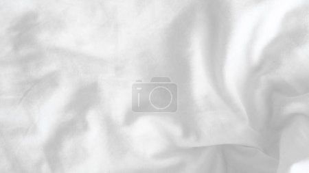 .Smooth white fabric background, minimalist elegance for product presentation or design projects
