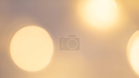 Golden bokeh background with soft, shimmering lights creating a warm, dreamy, and elegant ambiance