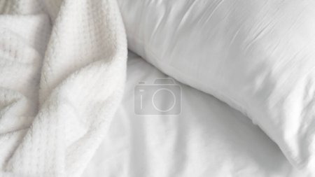 close up of white bedsheet background ,good hotel service. High quality photo