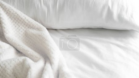 close up of white bedsheet background ,good hotel service. High quality photo