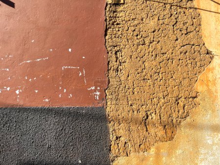 Photo for Old brick wall with black and brown stucco in Oaxaca, Mexico. Background Textures. - Royalty Free Image