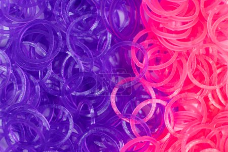 Photo for Pink and purple elastic bands for weaving bracelets for girls. - Royalty Free Image