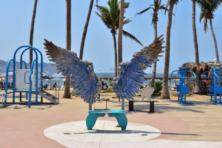 Photo for Acapulco, Mexico - April 27 2024: Photograph of some wings for people to take photos in a park between the coastal avenue and the beach - Royalty Free Image