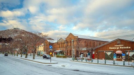 Photo for DEC 21, 2019 Hakodate, Japan - Cityscape of the historic red brick warehouses and Mount Hakodate in Hakodate, Hokkaido Japan in winter - Royalty Free Image