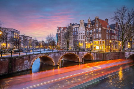 Photo for Downtown Amsterdam city skyline. Cityscape  in Netherlands at sunset - Royalty Free Image