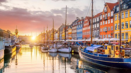 Photo for Cityscape of downtown Copenhagen city skyline in Denmark at famous old Nyhavn port at sunset - Royalty Free Image