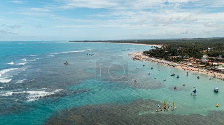 Photo for Porto de Galinhas, Pernambuco, Brazil - November 08, 2022 - aerial view of boats and tourists in the natural pools - Royalty Free Image