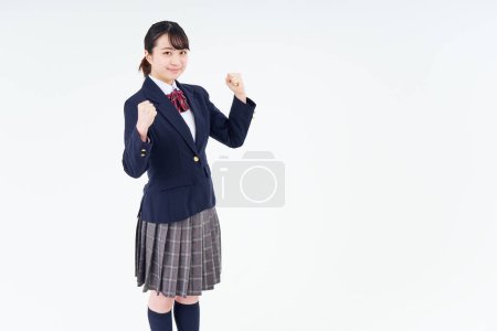 Téléchargez les photos : Une lycéenne acclamant et fond blanc - en image libre de droit