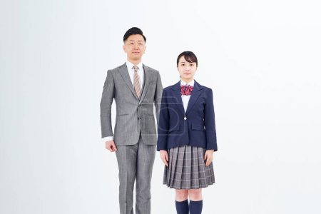 Téléchargez les photos : A man in a suit and a high school girl and white background - en image libre de droit