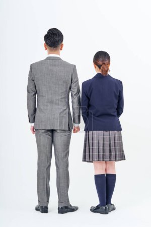 Téléchargez les photos : A man in a suit and a high school girl and white background - en image libre de droit