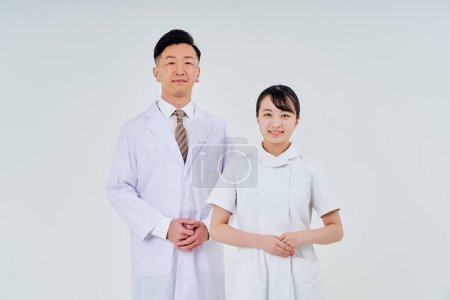 Photo for Man and woman in white coats  and white background - Royalty Free Image