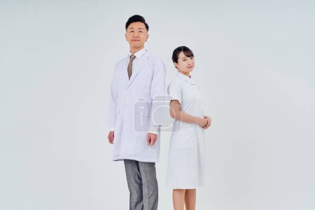 Photo for Man and woman in white coats  and white background - Royalty Free Image