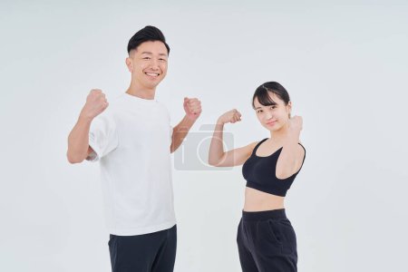 Photo for Man and woman in sportswear and white background - Royalty Free Image