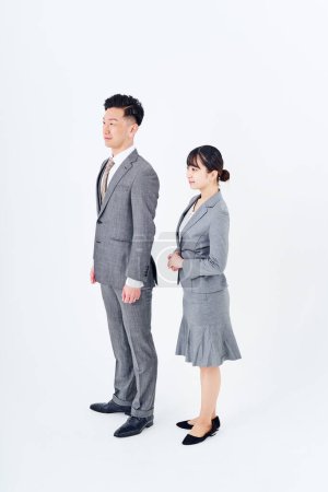 Photo for Man and woman in suits and white background - Royalty Free Image