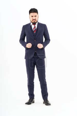 Téléchargez les photos : A man in a suit with a stressed expression and white background - en image libre de droit