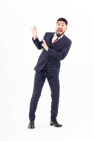 Photo for A man in a suit posing for refusal and white background - Royalty Free Image