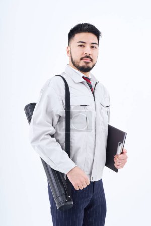 Photo pour Business person in work clothes and white background - image libre de droit