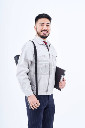 Photo pour Business person in work clothes and white background - image libre de droit