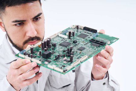 Photo pour A man in work clothes with a computer board  and white background - image libre de droit