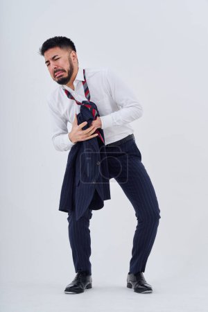 Téléchargez les photos : A man in a suit with a stressed expression with his clothes messed up - en image libre de droit