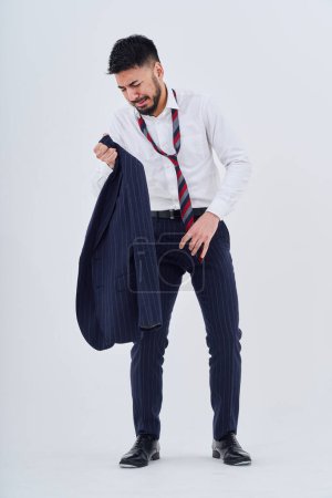 Photo for A man in a suit with a stressed expression with his clothes messed up - Royalty Free Image