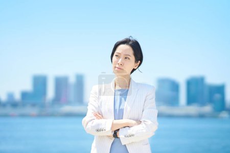 Photo for Business woman with a questioning expression on fine day - Royalty Free Image