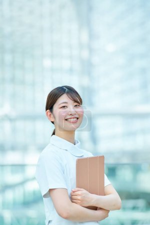 Photo for Portrait of working woman in white coat - Royalty Free Image