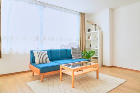 Photo for Bright interior with a blue sofa - Royalty Free Image