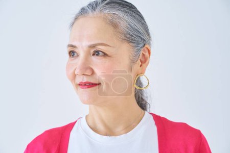 Photo for Portrait of a smiling senior woman indoors - Royalty Free Image