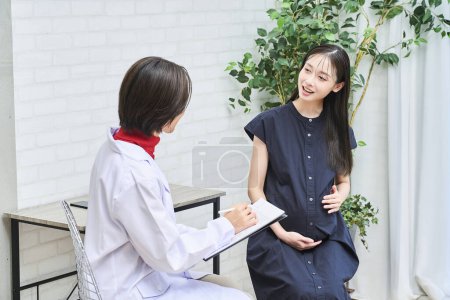 Photo for Pregnant woman being examined at the hospital - Royalty Free Image