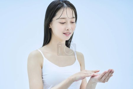 Photo for Asian young woman cares her skin - Royalty Free Image