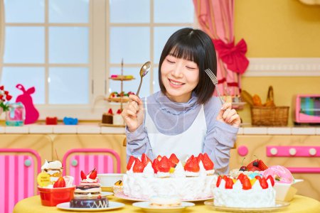Téléchargez les photos : Une jeune femme entourée de bonbons dans la chambre - en image libre de droit