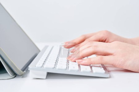 Photo for Hands of a woman typing on a keyboard - Royalty Free Image