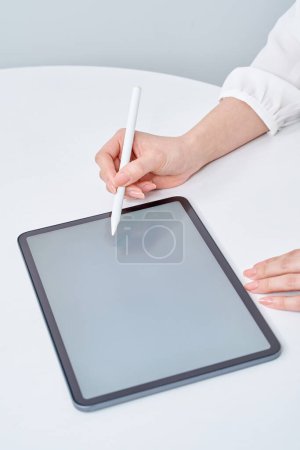 Photo for Hand of a woman operating a stylus pen - Royalty Free Image