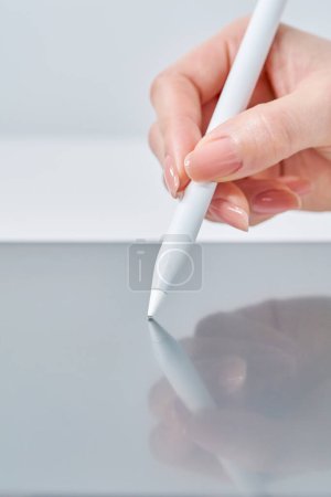 Photo for Hand of a woman operating a stylus pen - Royalty Free Image