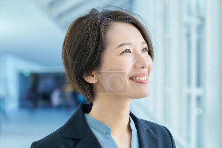 Profile of a smiling businessman on the aisle