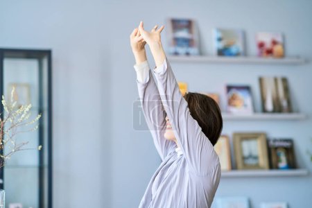 middle aged woman relaxing in the room
