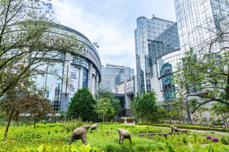 Photo for Brussels, Belgium, 25.05.2024: Buildings in the European quarter where European Parliament, European Commission and other institutions are located. In the foreground Leopold Park with sculptures. - Royalty Free Image