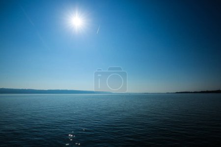 glittering Ammersee with blue sky in summer