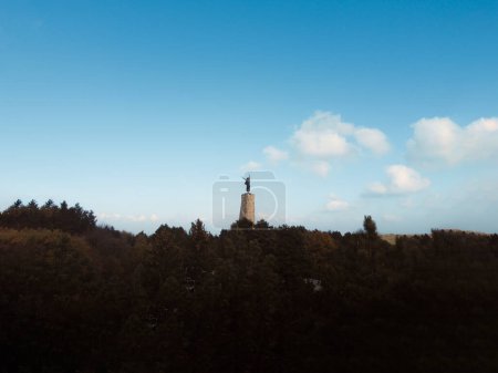 Photo for Landscape of a pine forest with a communist monument - Royalty Free Image