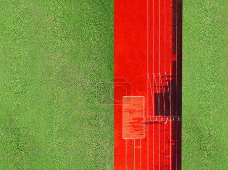 Photo for Aerial view of a man running on a track field - Royalty Free Image