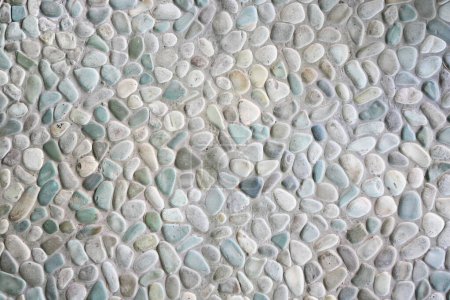 Pebble stone wall texture. Tiles Design for Floor. Background of cobblestone wall texture for design and decoration. Colorful Pebble stone wall texture background for interior exterior decoration and industrial construction concept design.