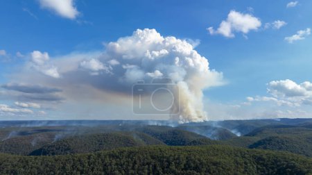 Drone aerial photograph of controlled bush fire hazard reduction burning by the Rural Fire Service in the Blue Mountains in NSW, Australia.