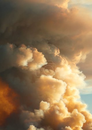 Photograph of smoke in the sky from controlled bush fire hazard reduction burning by the Rural Fire Service in the Blue Mountains in NSW, Australia.