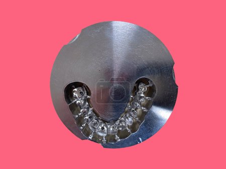 Photo for Photo of the jaw, a laser cut impression in a titanium metal block, a model of teeth, dental technique - Royalty Free Image