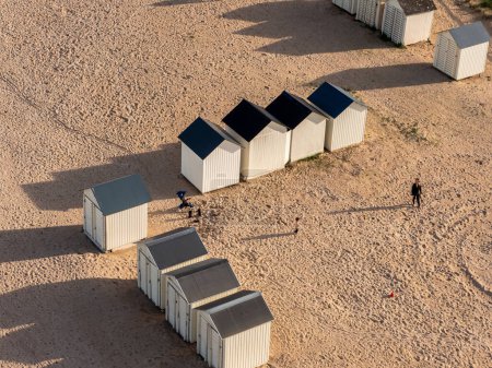 Ouistreham beach in Normandy, view of the wooden beach cabins from above, sand and sun