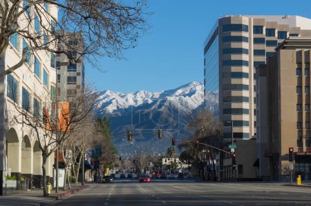 Photo for Pasadena, California, United States: Lake Avenue, looking north, showing the San Gabriel Mountains covered in snow after intense rainfall in Southern California, on February 26, 2023. - Royalty Free Image